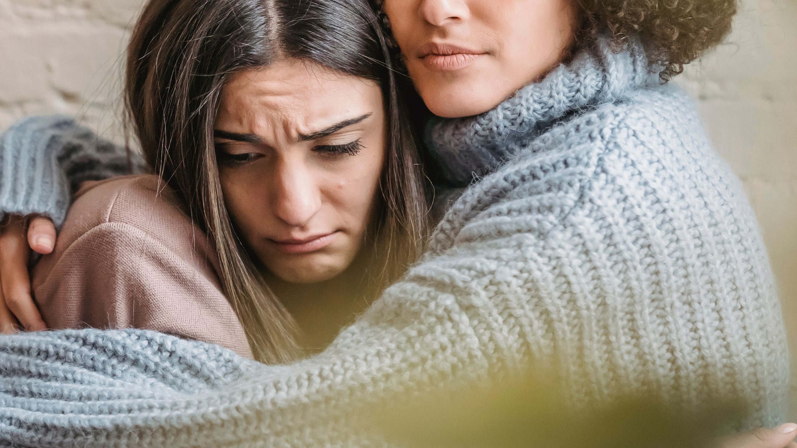 woman holding onto another woman struggling with treatment resistant depression medication in atlanta 