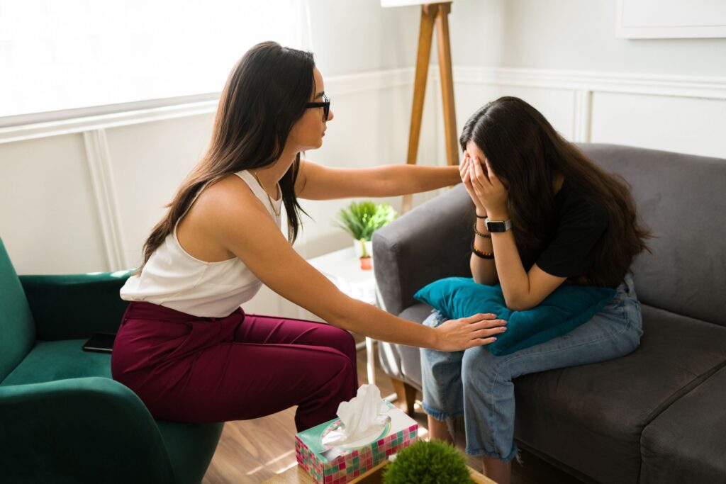 therapist comforting a patient explaining how do you know if you're having a nervous breakdown